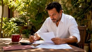 Business owner reviewing tax documents at home