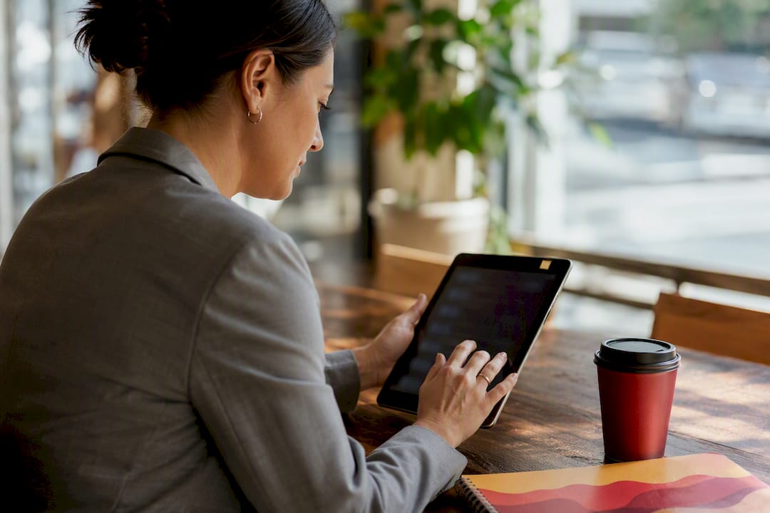 Hands organizing payroll digital records on tablet